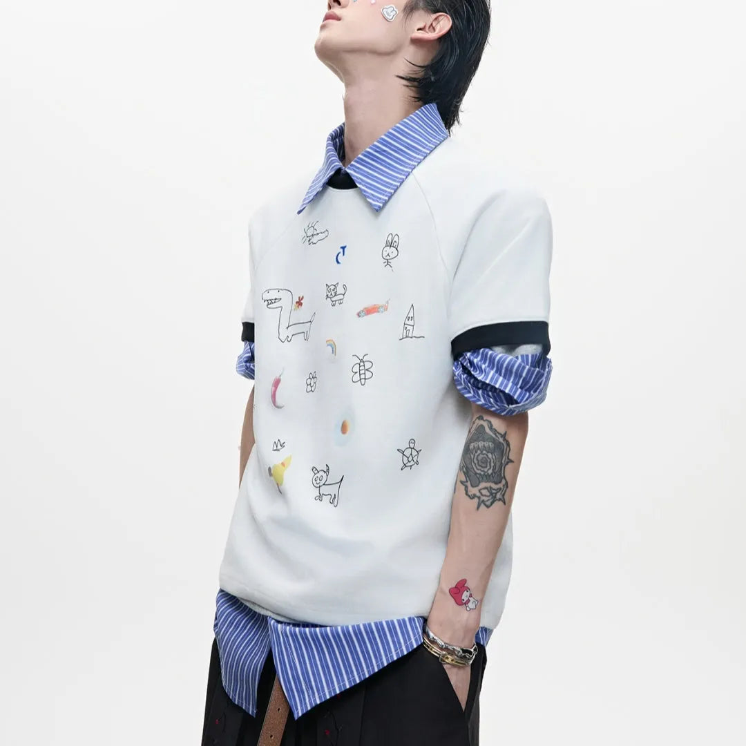 Man modelling a loose fit blue short sleeve shirt with a cartoon graphic print and contrast colour panels.