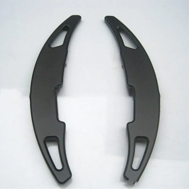 Pair of BMW M paddle shift extenders in black with screw and glue attachment