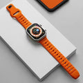 Fluoro rubber Apple Watch band with T-buckle clasp in multiple colours on a wrist.