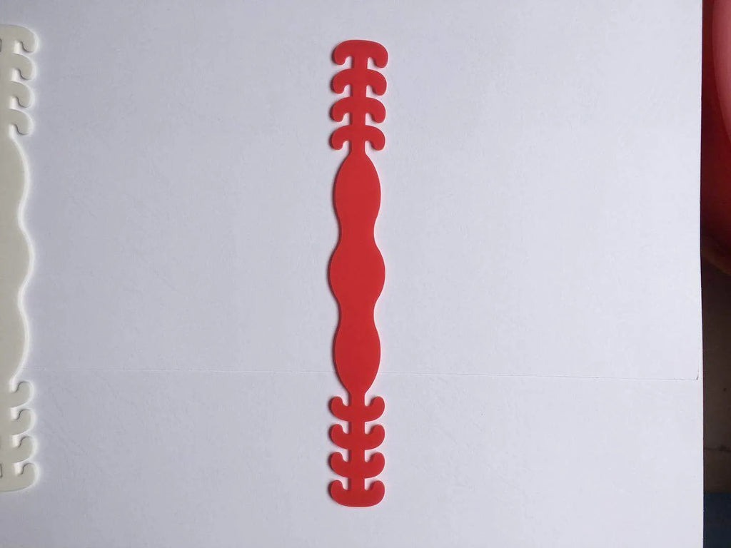 Eight silicone tool buckles in red, yellow, black, white, violet, pink, blue, and green colours.