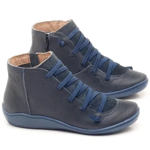Women's casual ankle boot with wedge heel and round toe in various colours including black and leopard print.