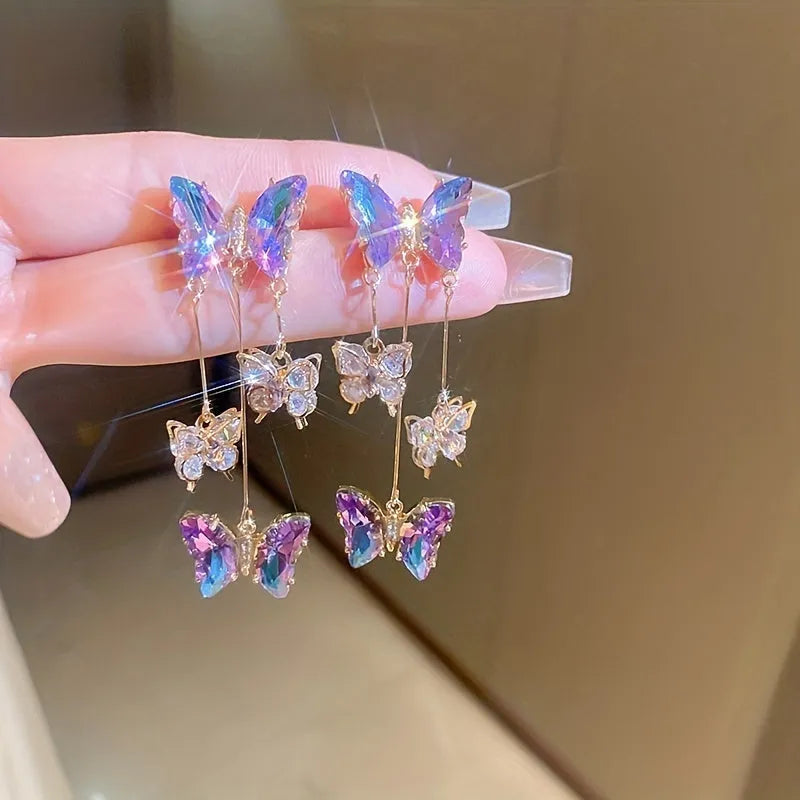 Silver Needle Crystal Flowers Butterfly Tassel Earrings in blue purple with a 5.5cm drop on a hypoallergenic alloy post.