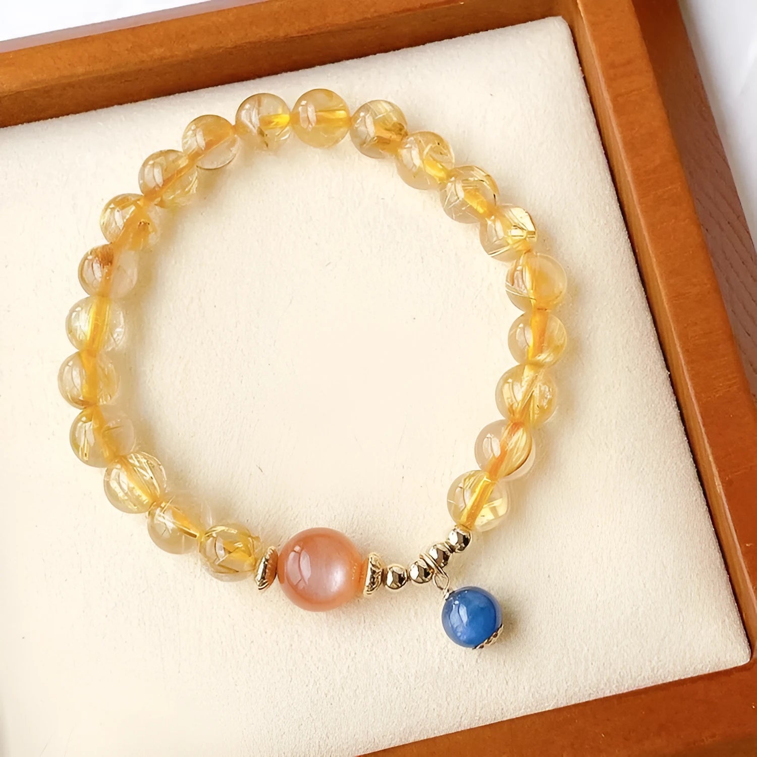 Gold rutilated quartz and sunstone crystal bracelet with diamond beads on adjustable band
