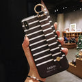 Samsung Galaxy phone case with integrated flip-out bracket grip holder on a simple TPU back cover.
