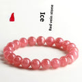 Women's geometric rhodochrosite crystal bracelet with a Longevity Lock centrepiece on a white background.