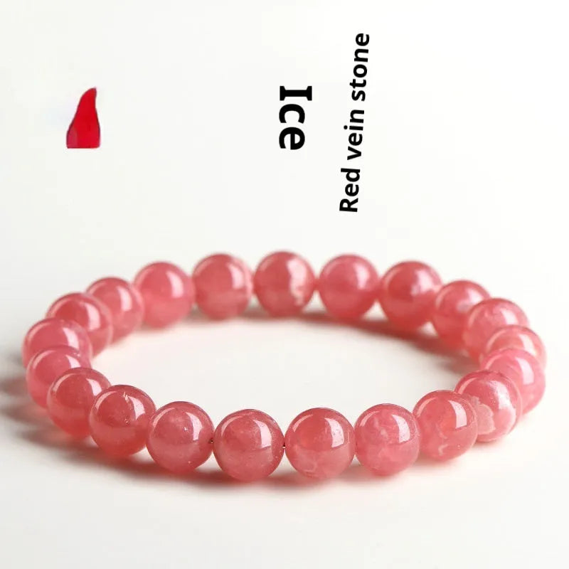 Women's geometric rhodochrosite crystal bracelet with a Longevity Lock centrepiece on a white background.