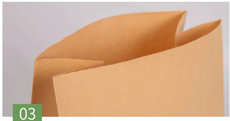 Yellow kraft paper tin foil bag with inner aluminium layer for snack food packaging.