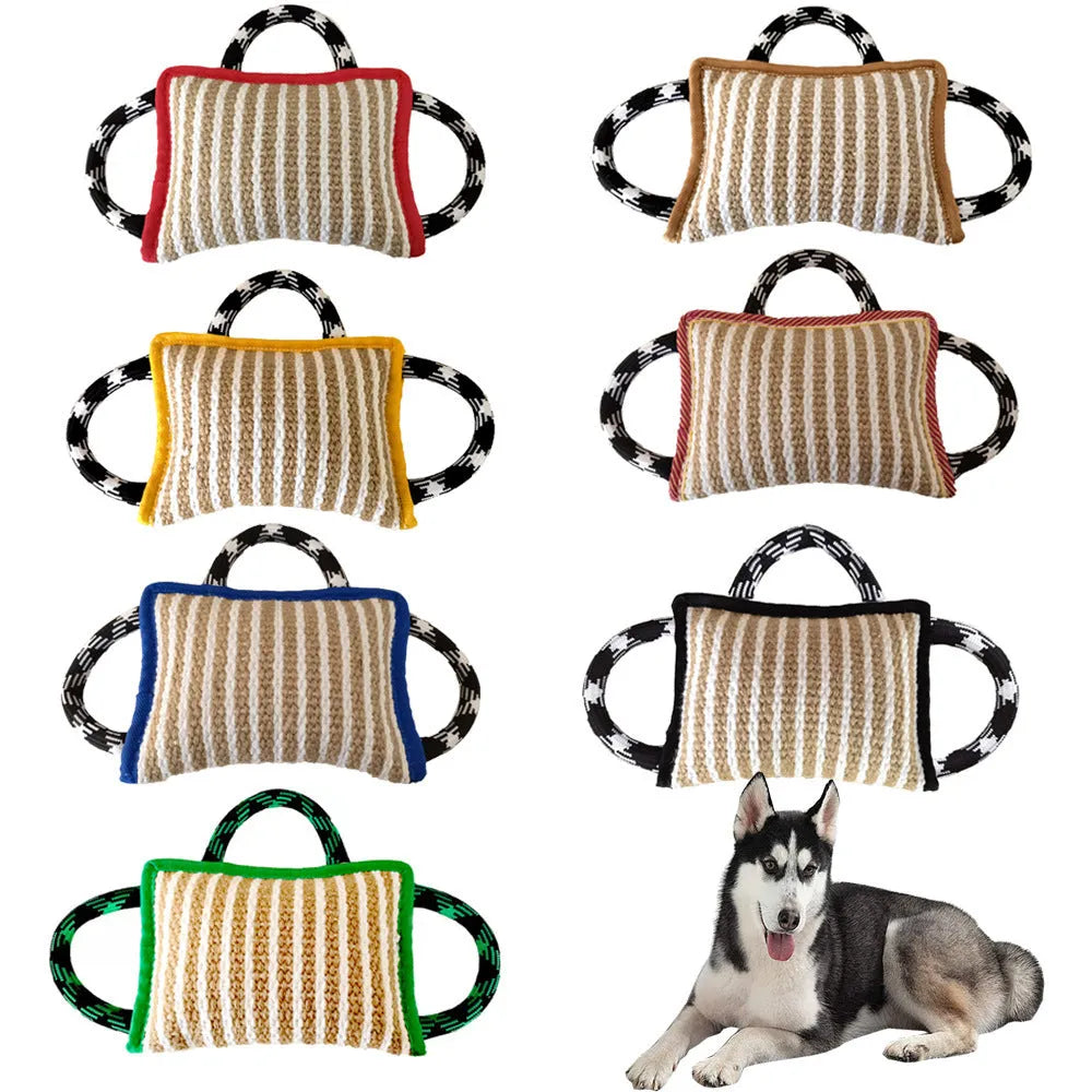 Jute dog tug toy with three rope handles in assorted colours on a neutral background.