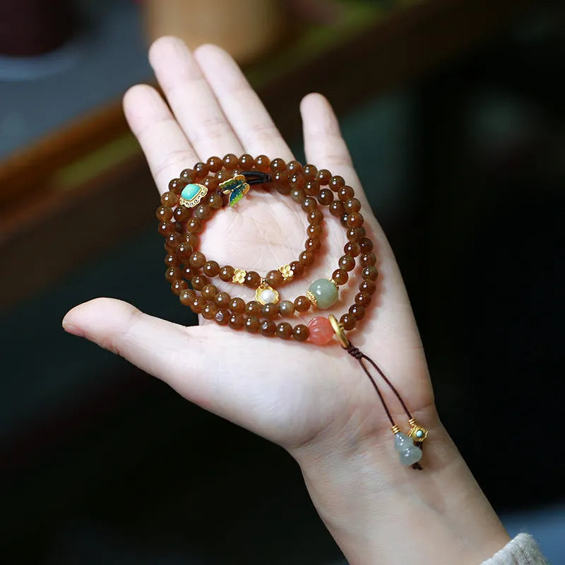 Brown jade Hetian jade three-ring bracelet with butterfly and gourd pearl design