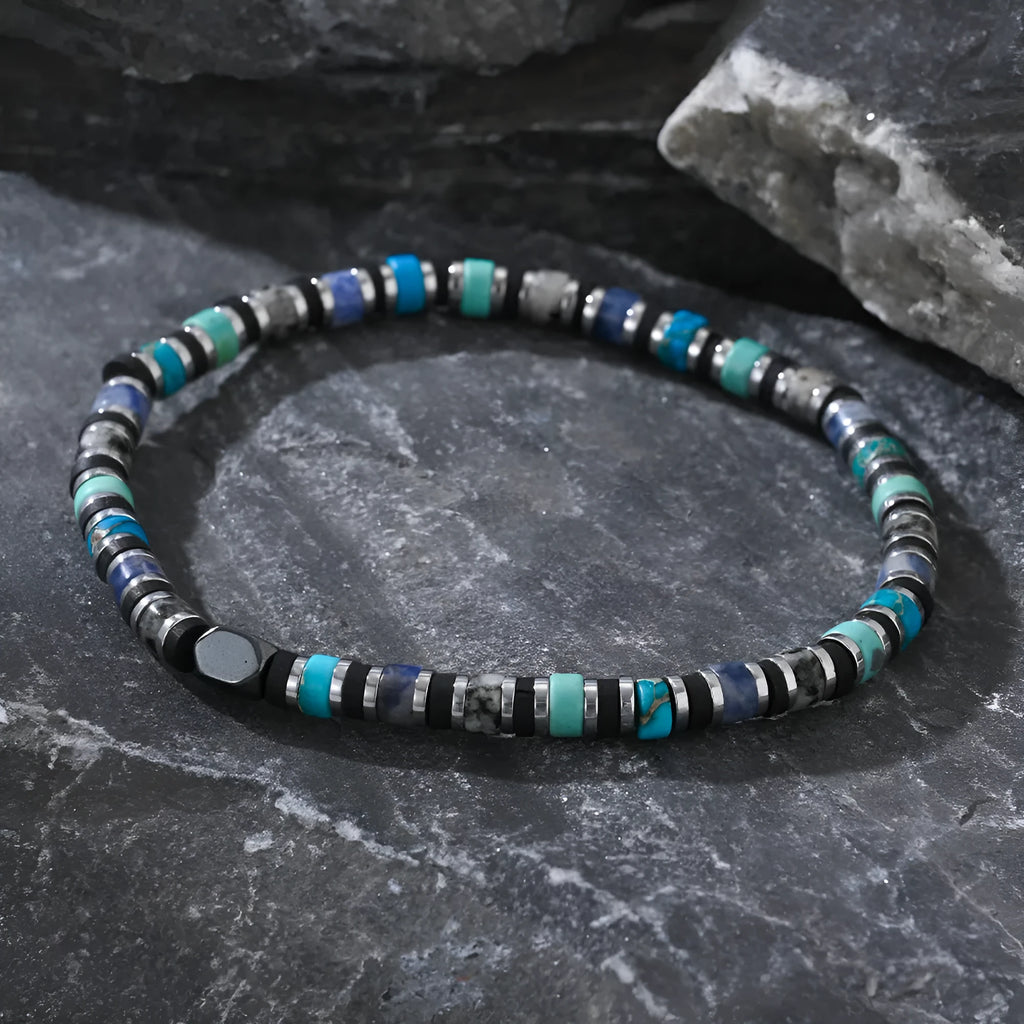 Hand-woven bohemian bracelet with natural semi-precious stones in cylindrical geometry design