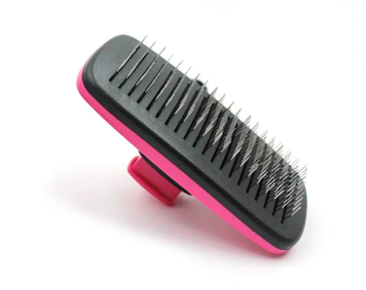 Rose red pet grooming comb with stainless steel teeth on white background