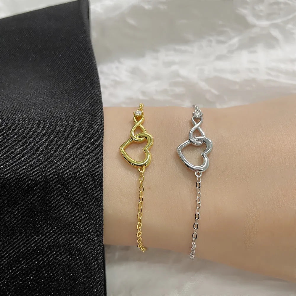 Heart-shape copper bracelet with clear 3A zirconia stone on adjustable chain in platinum finish