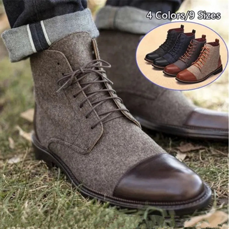 Men's black leather motorcycle boots with metal buckle strap on shaft, shown on a wooden floor.