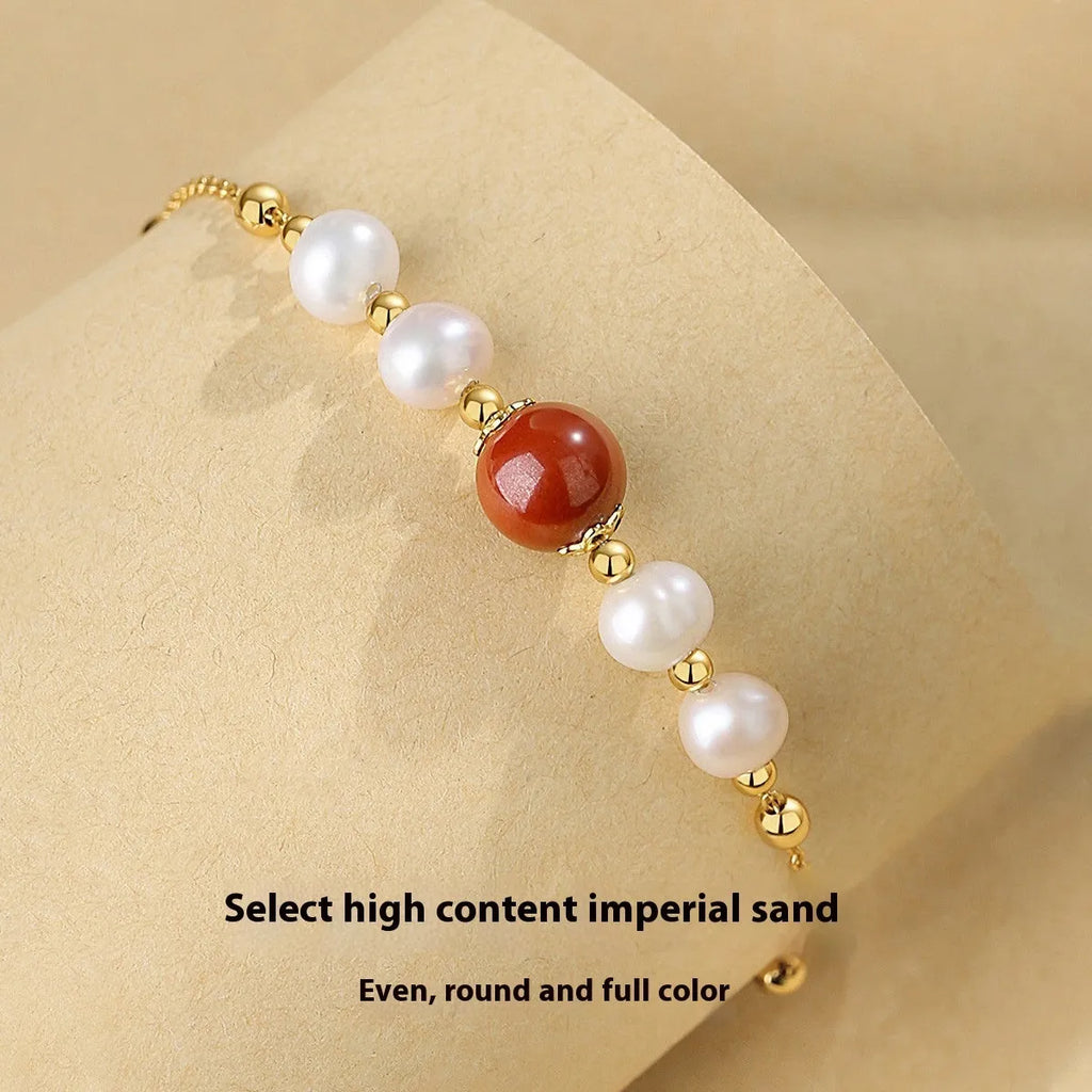 Yellow-finished 925 silver bracelet with red bean and pearl beads in retro style for women