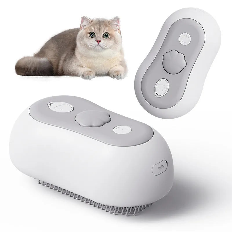 A handheld grey cat grooming massage comb with a brush head and built-in spray nozzle.