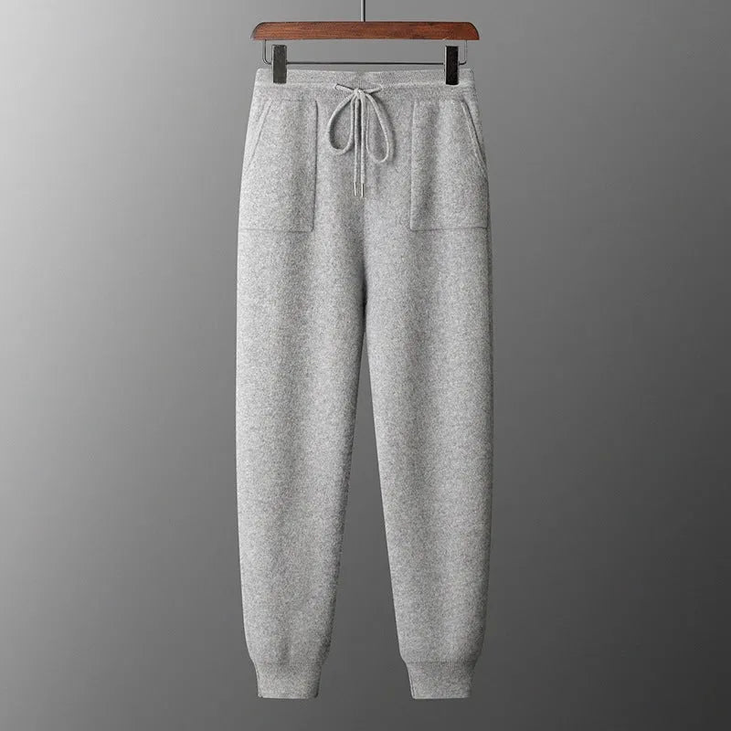 Men's light grey cashmere hooded sweatshirt and long pants casual winter set laid flat.
