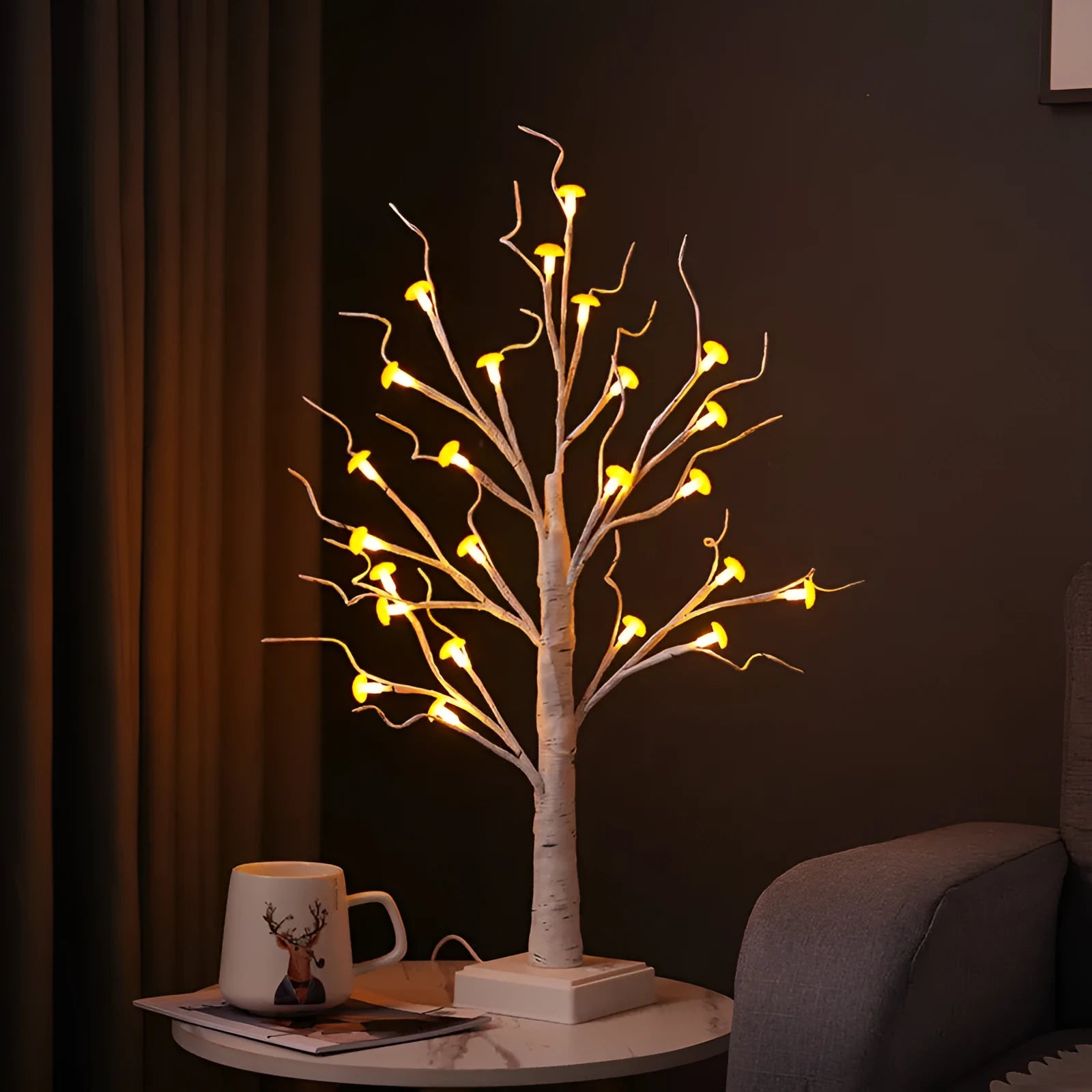 60cm tall white birch tree LED lamp with small red detachable mushroom flowers on a table.