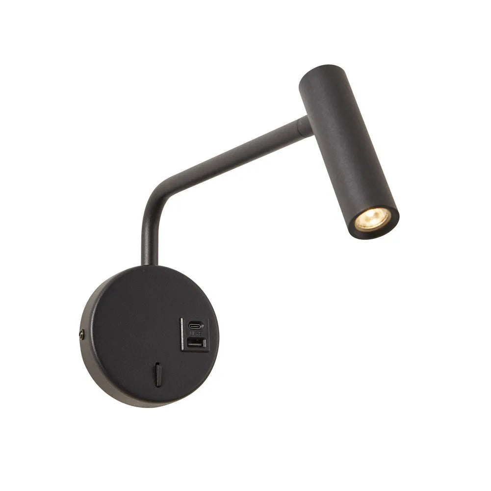 Black minimalist rocker reading wall lamp with LED light on a white wall