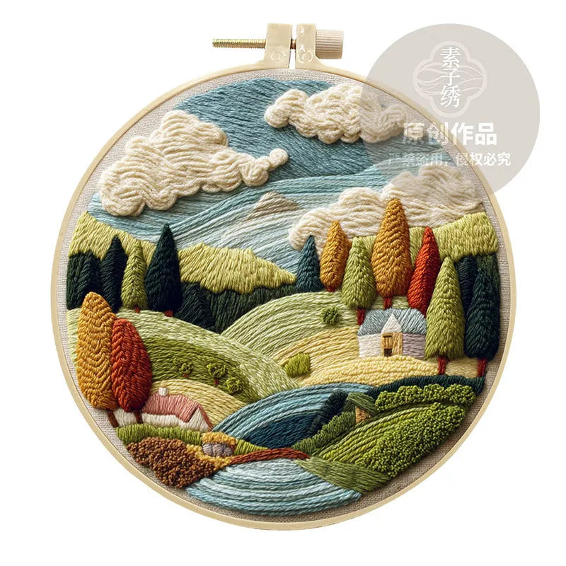 Embroidery DIY kit with landscape-printed cotton fabric, embroidery threads, and needles for handmade cloth art
