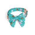 Pure cotton dog necklace with removable red bow tie on a light background showing size options