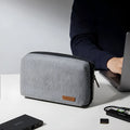 Grey polyester cylindrical storage bag for data cables and small electronics with sealing closure
