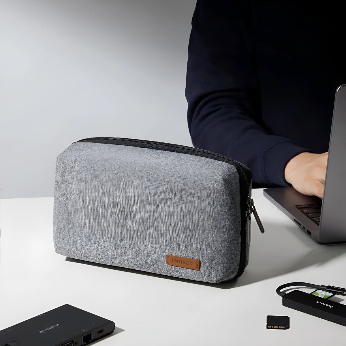 Grey polyester cylindrical storage bag for data cables and small electronics with sealing closure