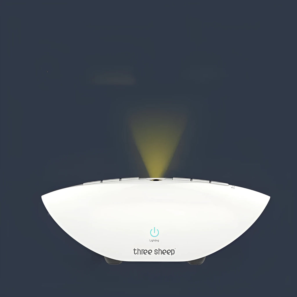 White noise sleep aid machine with mechanical buttons in white finish showing timer and volume controls