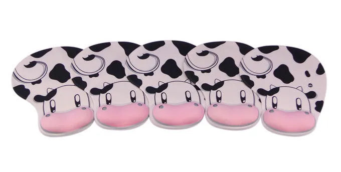 Cow silicone wrist mouse pad with soft hand rest and non-slip base on a desk