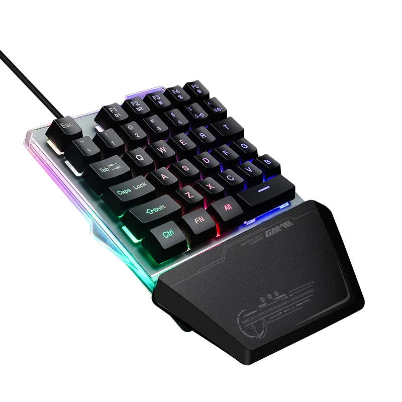 G40 Flow black one-handed mechanical keyboard with RGB backlit keys on a desk
