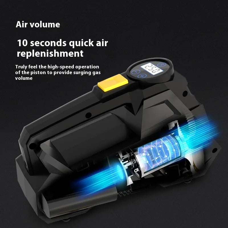 Black portable 12V tyre inflator with digital display and power cable on a garage floor