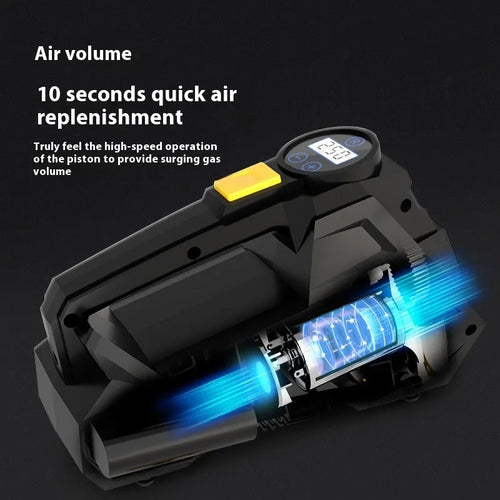 Black portable 12V tyre inflator with digital display and power cable on a garage floor