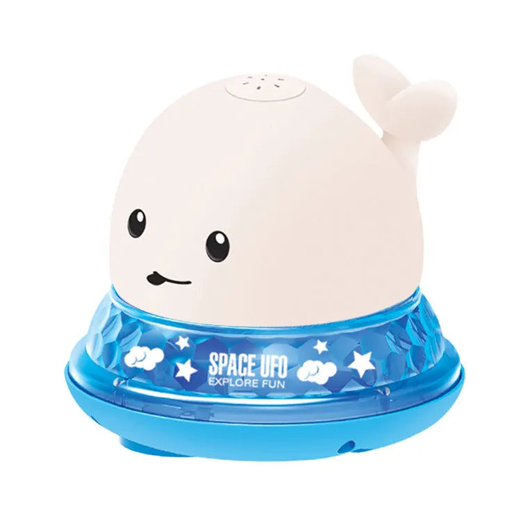 Grey and white whale bath toy spraying water with LED lights on water surface