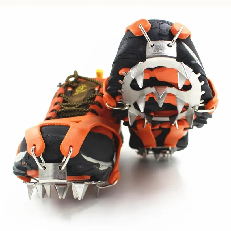 Reinforced non-slip crampons for shoes in black colour with large teeth, shown on a snowy surface