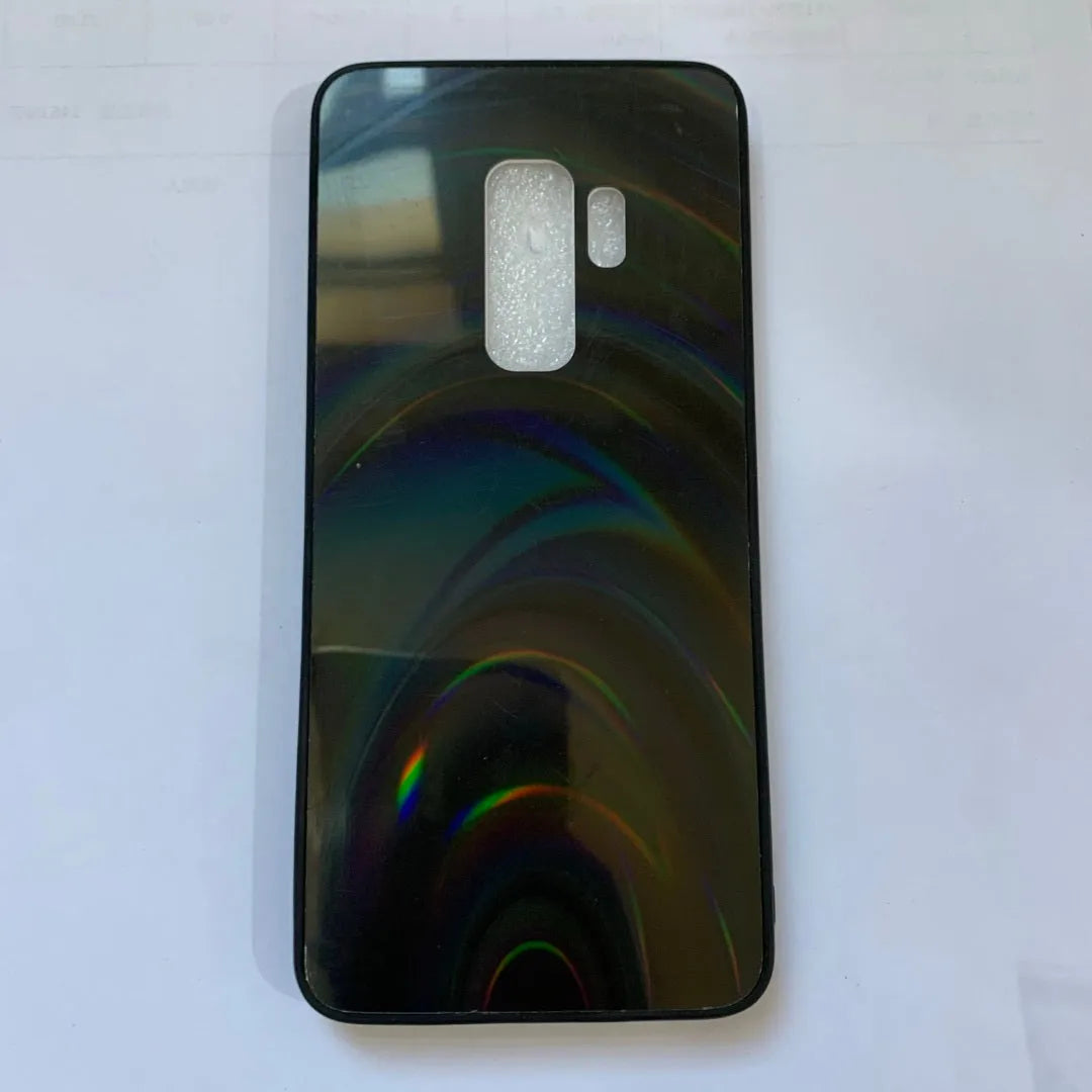 A 3D rainbow glitter gradient back cover case for a smartphone, showing its full-coverage design and sparkling finish.