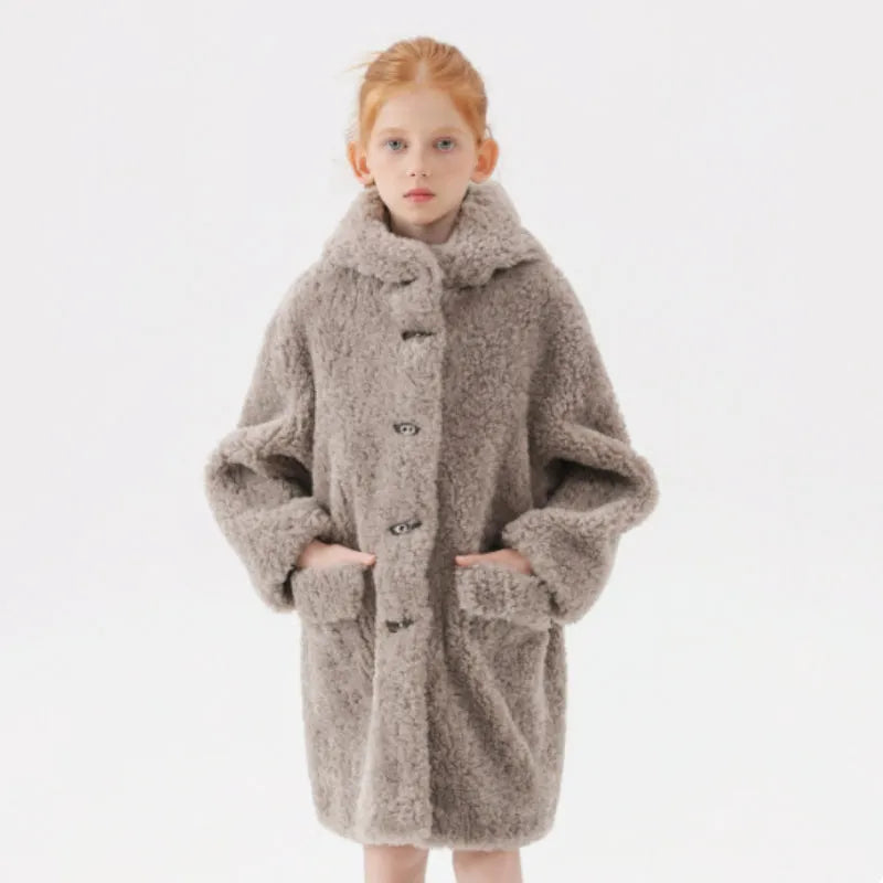 Girls imitation lamb wool mid-length polyester winter coat in pink, grey and white on a hanger