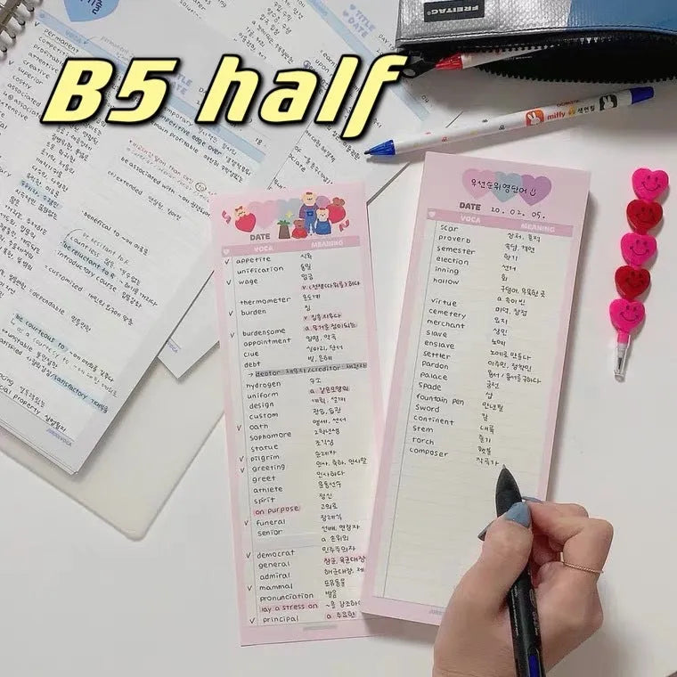 Vertical half-B5 notepad with English words, shown in pink, purple, and blue cover colour options.