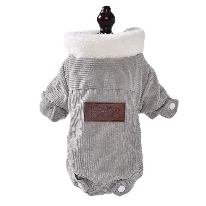 A gray lambswool-lined vest for a dog, showing the padded fleece construction and vest style.