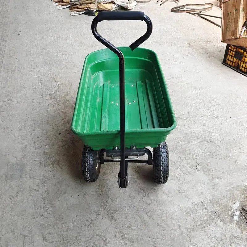 Green four-wheel steel and plastic dump truck with large load bed.