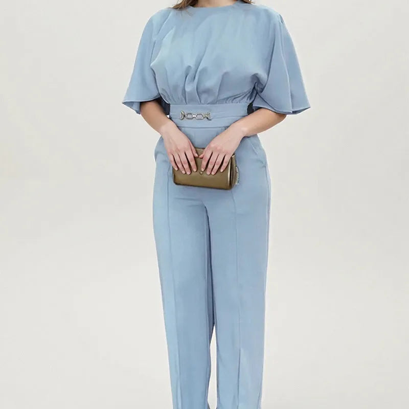 Blue polyester men's formal suit with long sleeve jacket and trousers on a hanger.