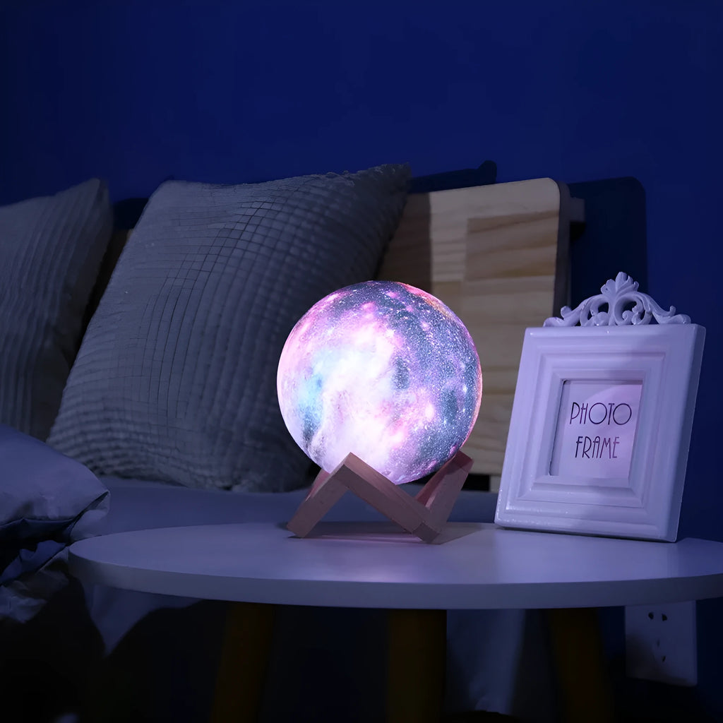3D printed spherical lunar night light on a table, demonstrating remote control and colour-changing LED effects.