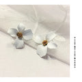 Women's flower stud earrings in pink and white colours with electroplated finish