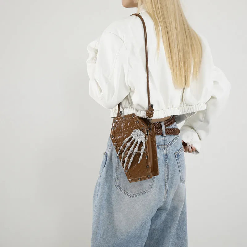 Trendy one-shoulder embossed handbag in brown with single strap and square vertical shape on white background.