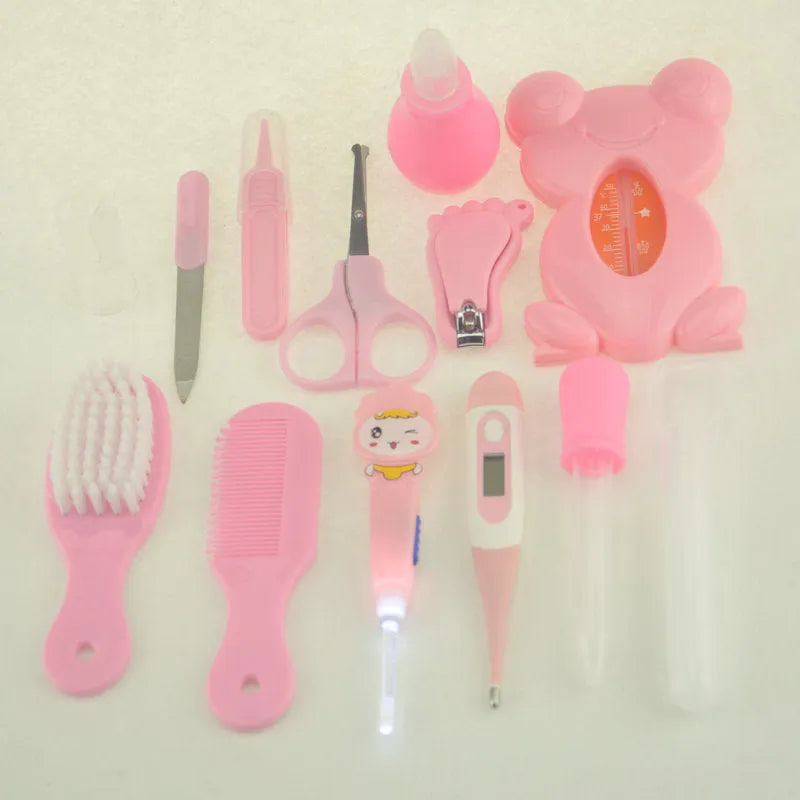 Roadfisher newborn baby care kit with grooming tools and health monitoring devices in blue or pink colour