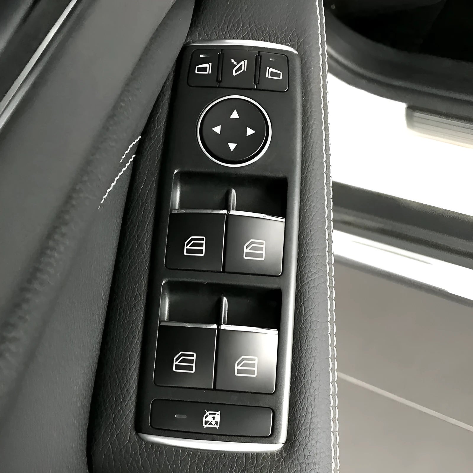 Black ABS plastic self-adhesive decorative sticker for a car window lift button.