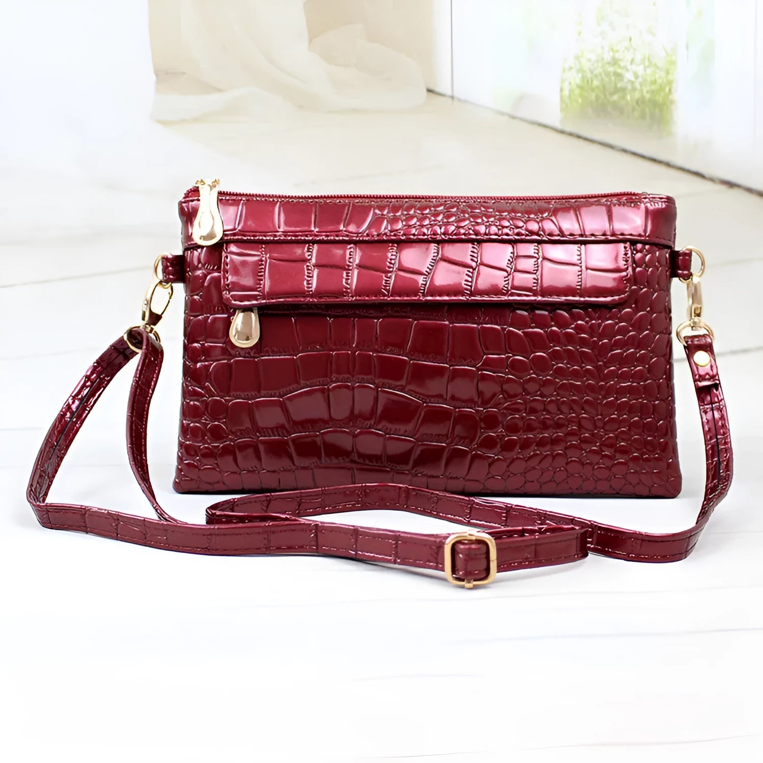 Women's black PU messenger shoulder bag with horizontal square shape showing 24cm width