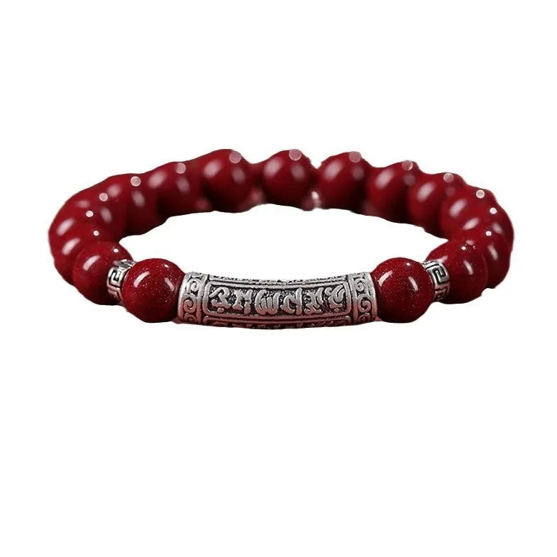Handmade cinnabar bracelet with purple gold sand beads in a unisex national style design.