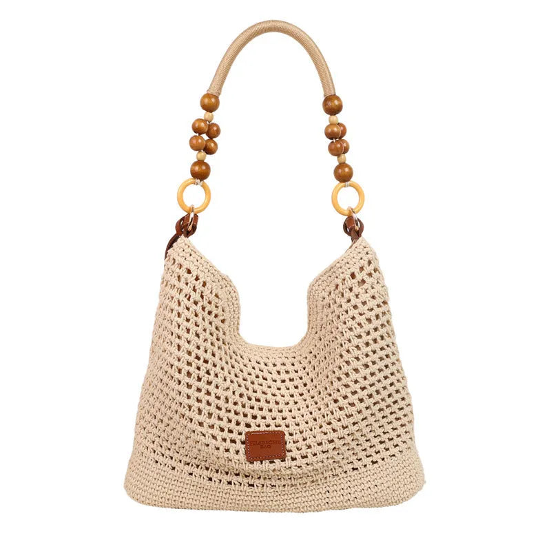 Knitted bucket tote beach bag in black or brown with contrast stitching and crossbody strap