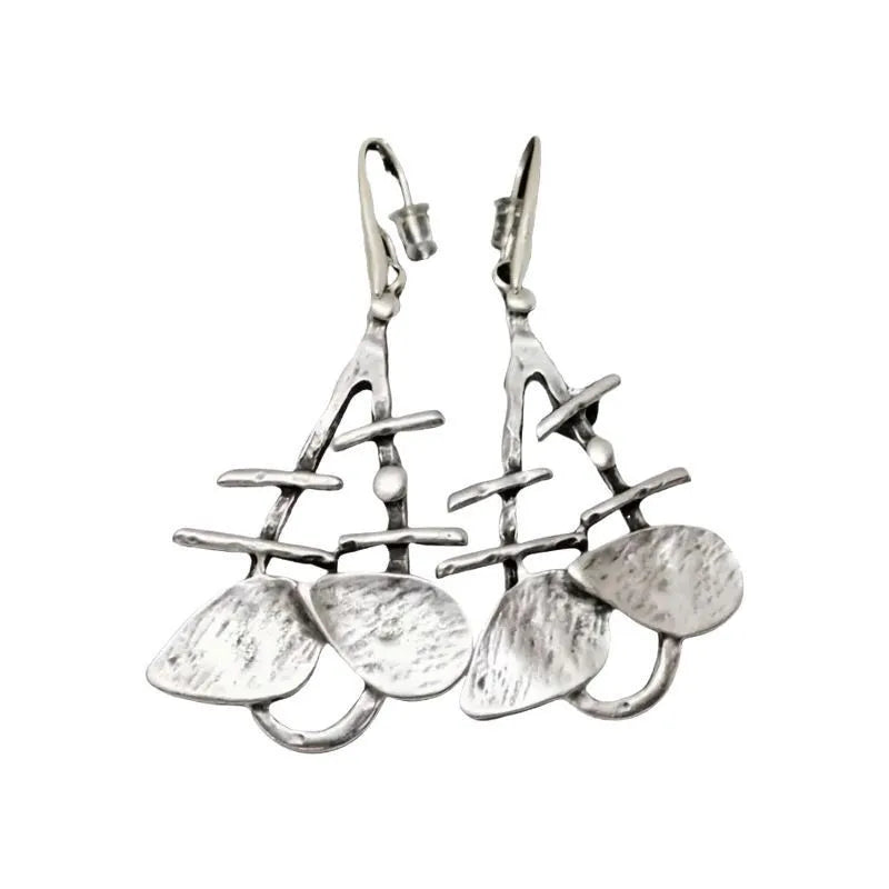 Retro creative leaves hollow step pendant earrings in silver alloy with irregular leaf shape for women's fashion
