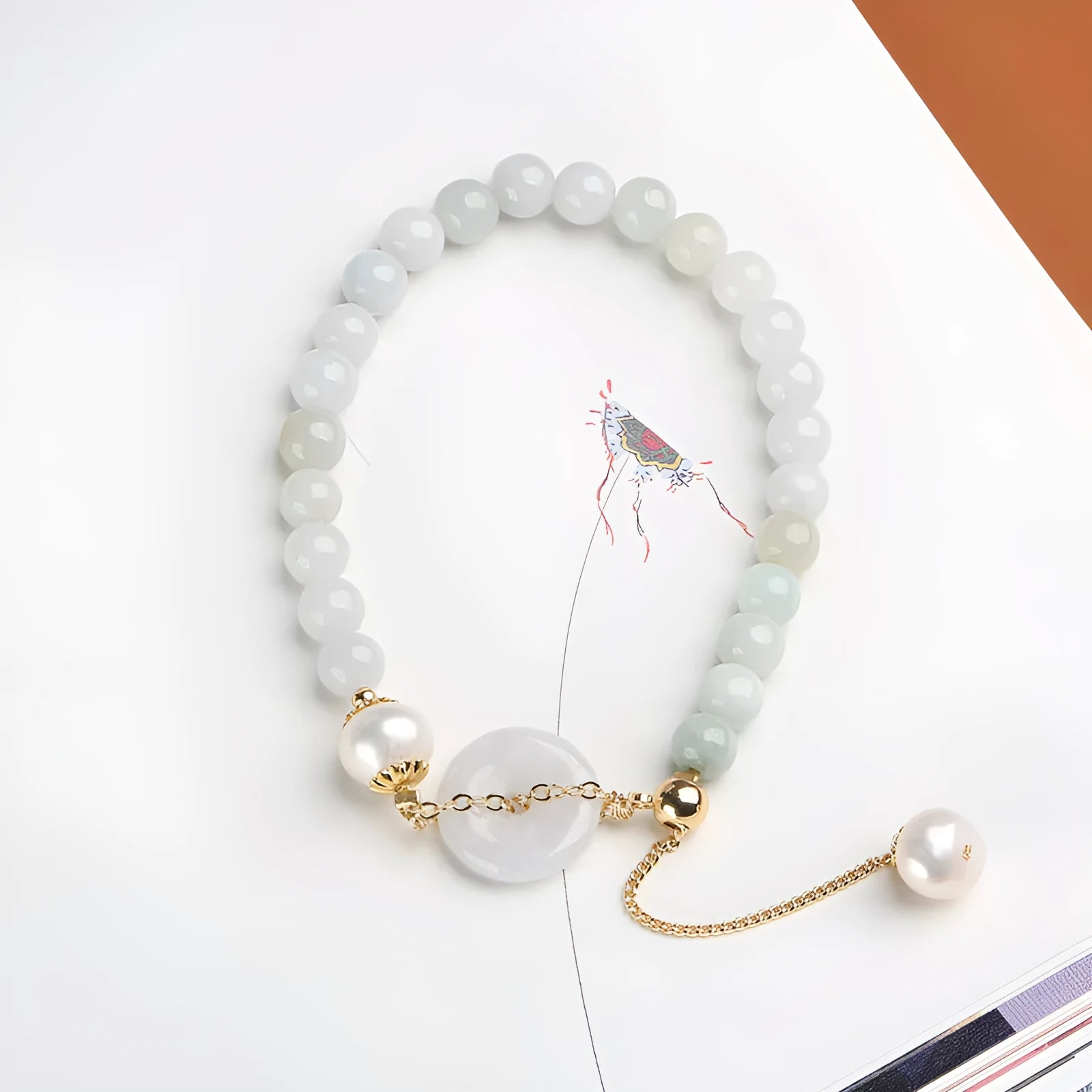 Natural emerald jade peace buckle bracelet with pearl accents and geometric pendant design