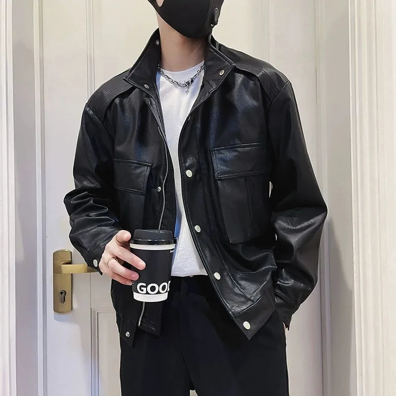 Man wearing a black Korean-style PU leather pilot jacket with a straight hem and side seam pockets.